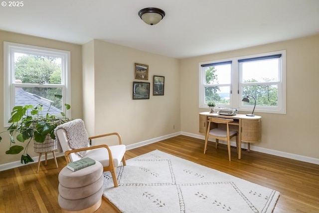 8100 SW 6th Ave, Portland, OR 97219 - home office with healthy amount of natural light, wood finished floors, and baseboards