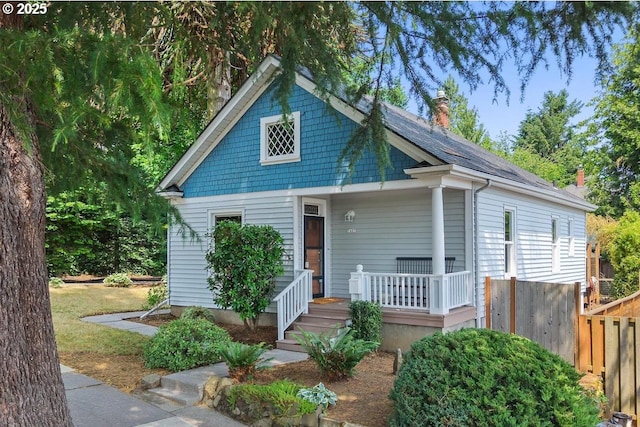 7407 SE Alder St, Portland, OR 97215 - view of front facade with a chimney and a porch