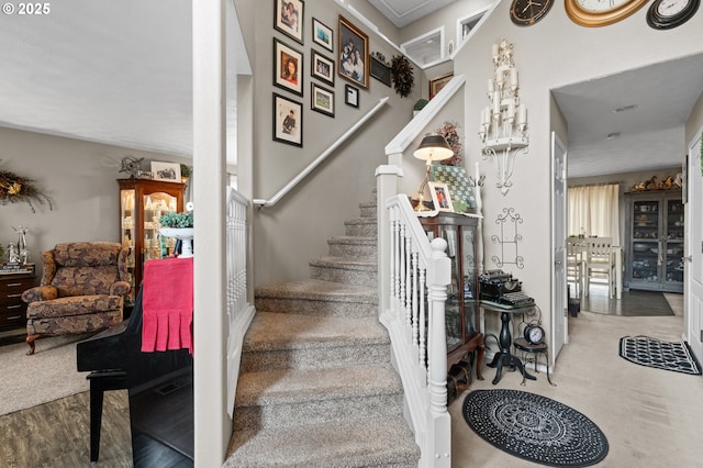 stairway with wood finished floors