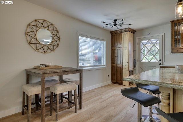 156 1st Ave, Coos Bay, OR 97420 - dining room featuring light wood-style floors and baseboards