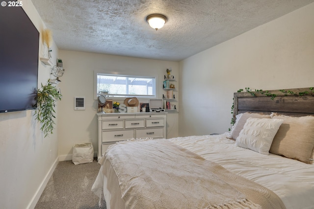 156 1st Ave, Coos Bay, OR 97420 - carpeted bedroom featuring a textured ceiling and baseboards