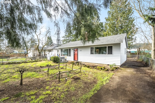 single story home featuring crawl space, a shingled roof, a chimney, and fence