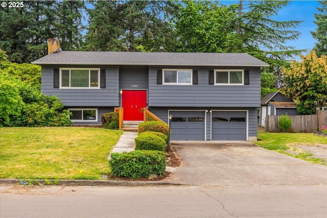 11995 SW 119th Ave, Portland, OR 97223 - raised ranch with a chimney, a garage, and asphalt driveway