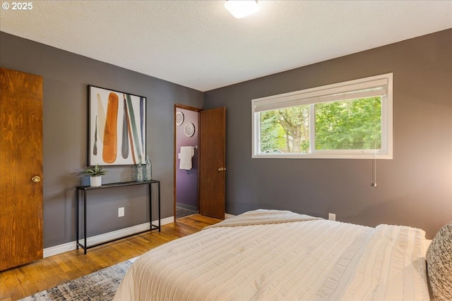 11995 SW 119th Ave, Portland, OR 97223 - bedroom with wood finished floors and baseboards