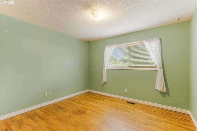 11995 SW 119th Ave, Portland, OR 97223 - unfurnished room with wood finished floors and a textured ceiling