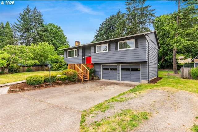 11995 SW 119th Ave, Portland, OR 97223 - raised ranch with a garage, concrete driveway, and a chimney