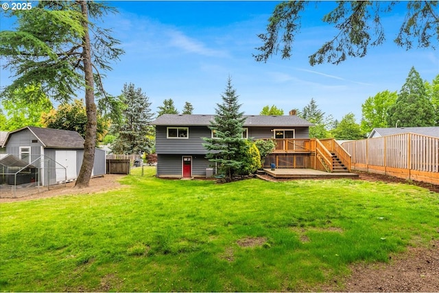 11995 SW 119th Ave, Portland, OR 97223 - rear view of property featuring a fenced backyard, a wooden deck, a storage shed, and a chimney