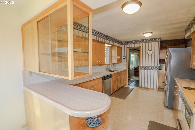 383 Little Valley Rd, Roseburg, OR 97471 - kitchen with glass insert cabinets, a sink, appliances with stainless steel finishes, tile countertops, and light floors