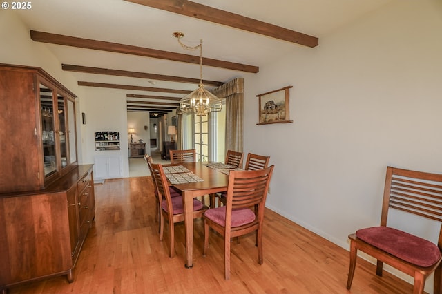 383 Little Valley Rd, Roseburg, OR 97471 - dining room with beamed ceiling, light wood finished floors, baseboards, and an inviting chandelier