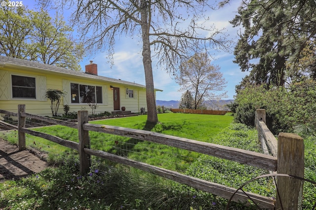 383 Little Valley Rd, Roseburg, OR 97471 - view of front of home with a front lawn, fence, and a chimney