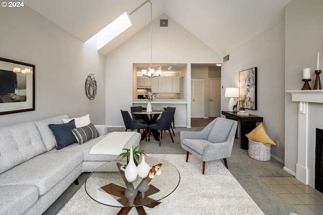 1710 S Harbor Way Unit C405, Portland, OR 97201 - carpeted living room with high vaulted ceiling, a chandelier, a skylight, baseboards, and a fireplace with flush hearth