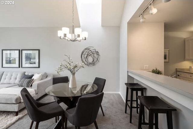 1710 S Harbor Way Unit C405, Portland, OR 97201 - dining area with a chandelier, rail lighting, and carpet flooring