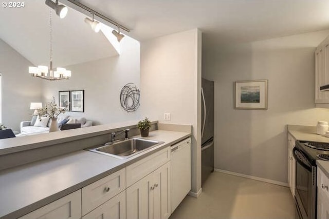 1710 S Harbor Way Unit C405, Portland, OR 97201 - kitchen with a sink, black range, freestanding refrigerator, white dishwasher, and a chandelier