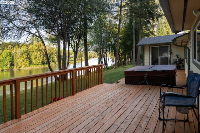 15928 N Umpqua Hwy, Roseburg, OR 97470 - wooden deck featuring a covered hot tub, a water view, and a yard