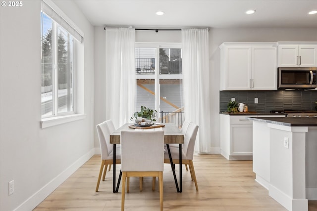 dining space with light wood-type flooring