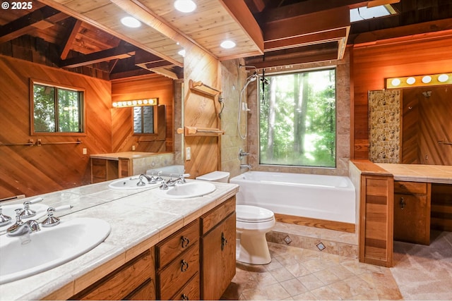 18020 SW Neugebauer Rd, Hillsboro, OR 97123 - bathroom featuring wood walls, a tub to relax in, plenty of natural light, double vanity, and toilet