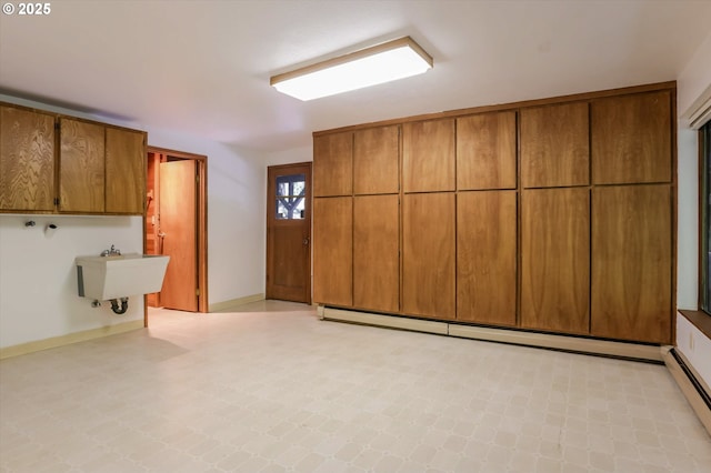 18020 SW Neugebauer Rd, Hillsboro, OR 97123 - washroom with cabinet space, light floors, a baseboard radiator, and baseboards