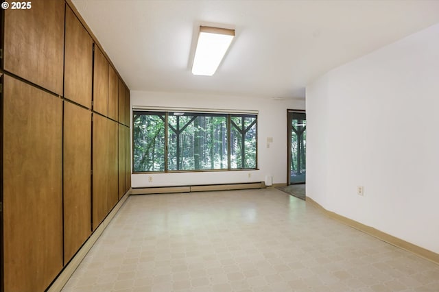 18020 SW Neugebauer Rd, Hillsboro, OR 97123 - unfurnished room featuring a baseboard radiator, light floors, and baseboards