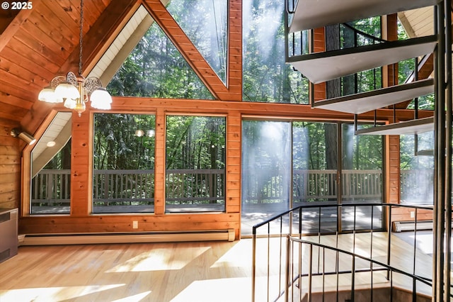 18020 SW Neugebauer Rd, Hillsboro, OR 97123 - unfurnished sunroom with a baseboard heating unit, wood finished floors, a chandelier, lofted ceiling, and a baseboard radiator