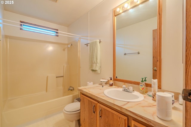 bathroom featuring tub / shower combination, toilet, and vanity