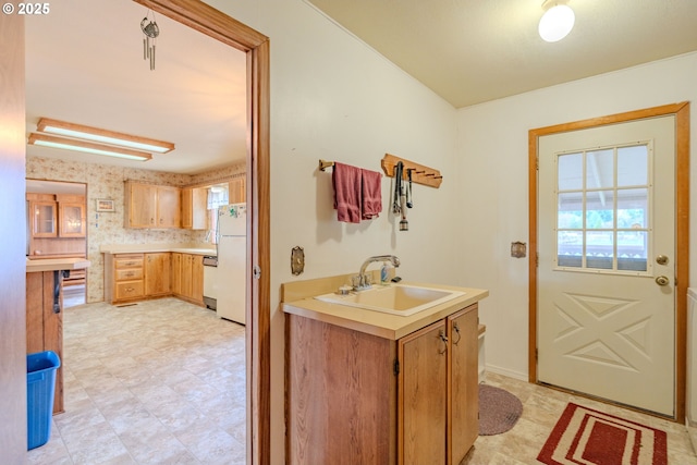 bathroom featuring tile patterned floors, a healthy amount of sunlight, and vanity