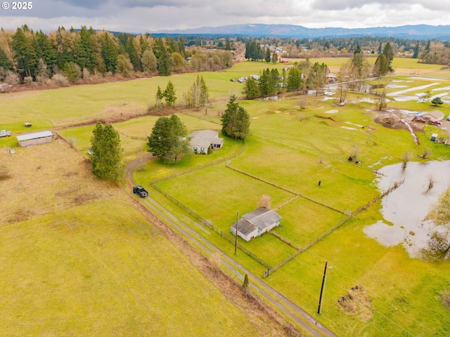 aerial view featuring a rural view and a mountain view