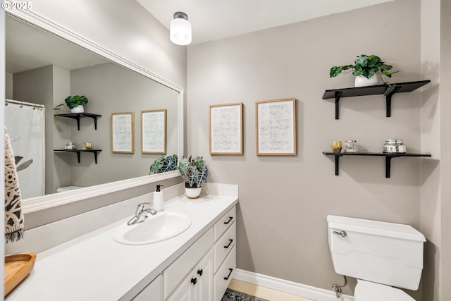 full bathroom featuring toilet and vanity