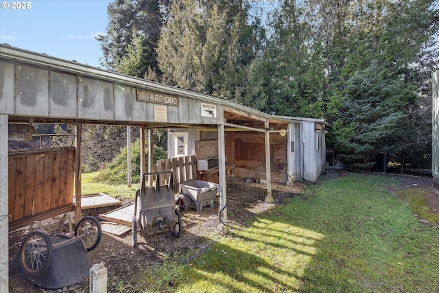 view of outbuilding featuring a lawn