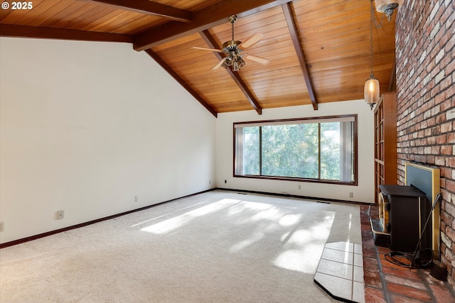 unfurnished living room with vaulted ceiling with beams, wood ceiling, and dark carpet