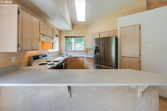 9120 NE 54th St, Vancouver, WA 98662 - kitchen with stainless steel fridge, electric range, light brown cabinetry, light countertops, and a peninsula