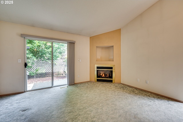 9120 NE 54th St, Vancouver, WA 98662 - unfurnished living room featuring carpet flooring, vaulted ceiling, and a glass covered fireplace