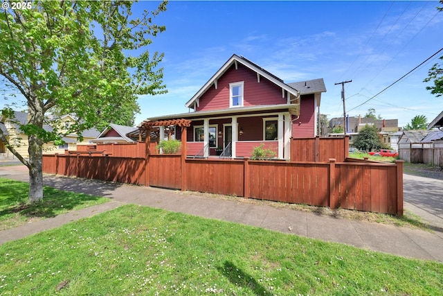 view of front facade with a fenced front yard and a porch