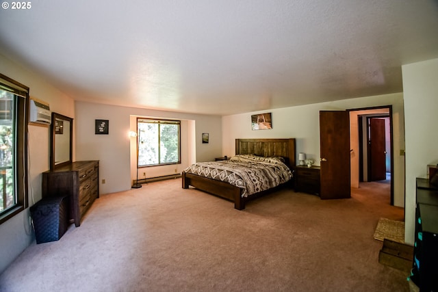 bedroom featuring a baseboard radiator, an AC wall unit, and light colored carpet