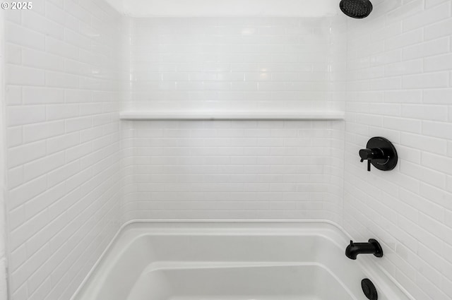 bathroom featuring  shower combination