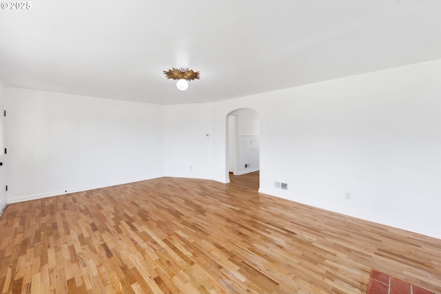 spare room with light hardwood / wood-style flooring