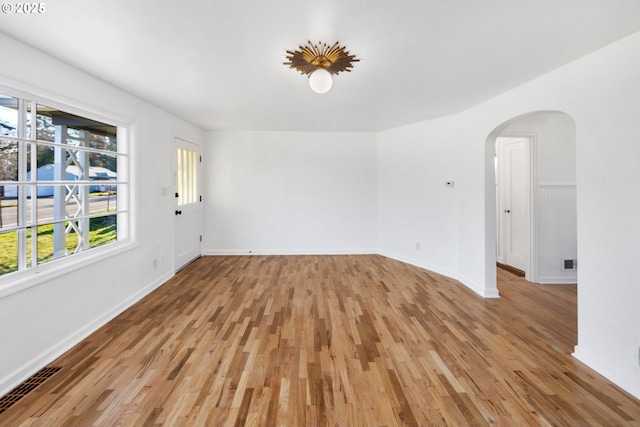 spare room featuring light wood-type flooring