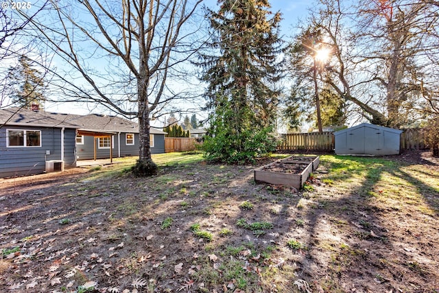 view of yard featuring cooling unit and a storage unit