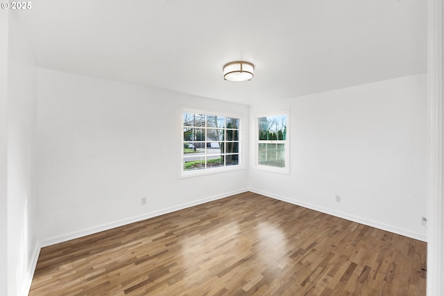 empty room featuring wood-type flooring