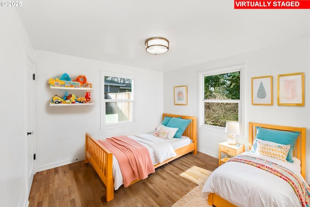 bedroom with hardwood / wood-style flooring