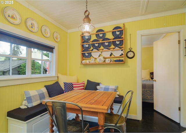 762 G St, Gearhart, OR 97138 - dining area featuring attic access, dark wood-style floors, and crown molding