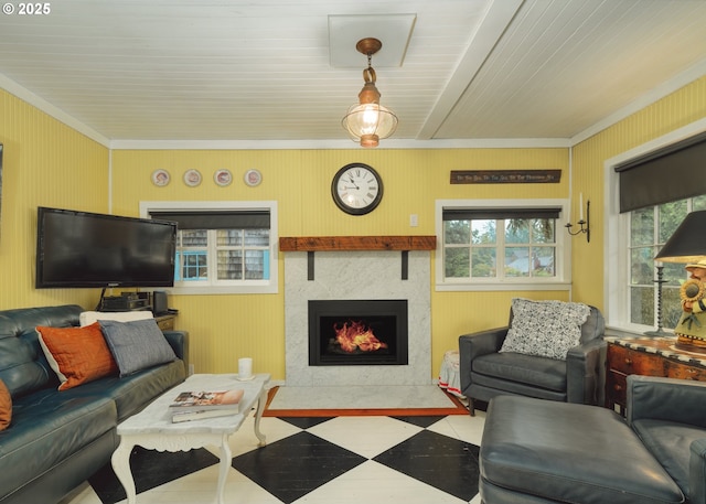 762 G St, Gearhart, OR 97138 - living room with ornamental molding, a fireplace with flush hearth, tile patterned floors, and wood walls