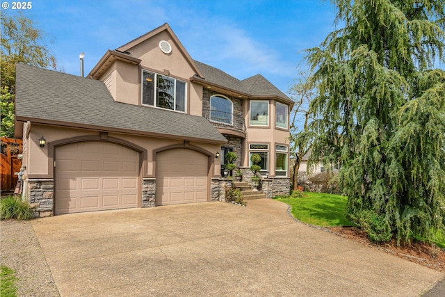 5711 SE Vista Ct, Milwaukie, OR 97267 - view of front facade featuring stone siding, stucco siding, concrete driveway, a garage, and roof with shingles