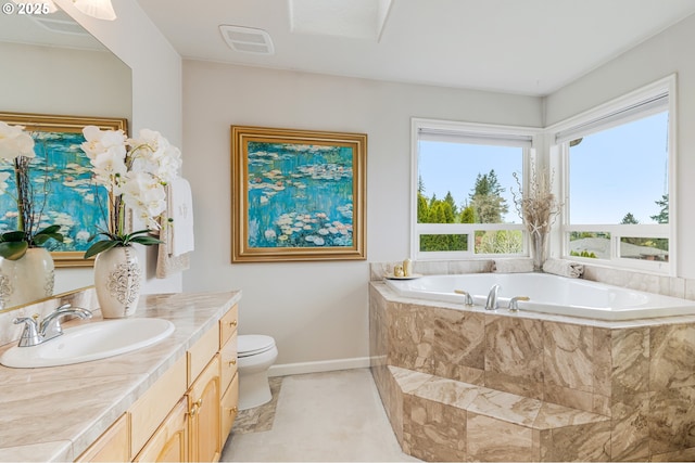 5711 SE Vista Ct, Milwaukie, OR 97267 - full bath featuring a garden tub, baseboards, vanity, and toilet