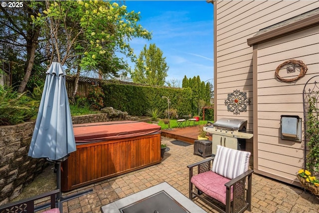 5711 SE Vista Ct, Milwaukie, OR 97267 - view of patio featuring a hot tub, area for grilling, and fence