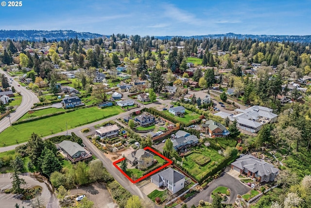 5711 SE Vista Ct, Milwaukie, OR 97267 - aerial view of property and surrounding area with property parcel outlined and nearby suburban area