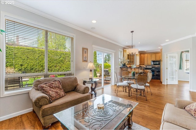 5711 SE Vista Ct, Milwaukie, OR 97267 - living room featuring ornamental molding, baseboards, recessed lighting, and light wood-style flooring