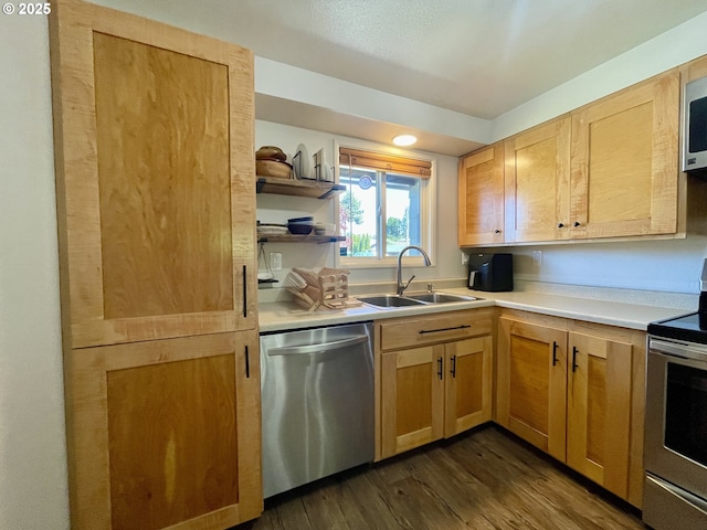 3851 Edgewood Dr, North Bend, OR 97459 - kitchen featuring appliances with stainless steel finishes, a sink, dark wood-type flooring, light countertops, and open shelves
