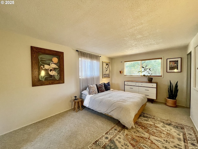 3851 Edgewood Dr, North Bend, OR 97459 - bedroom with carpet flooring, a textured ceiling, and baseboards