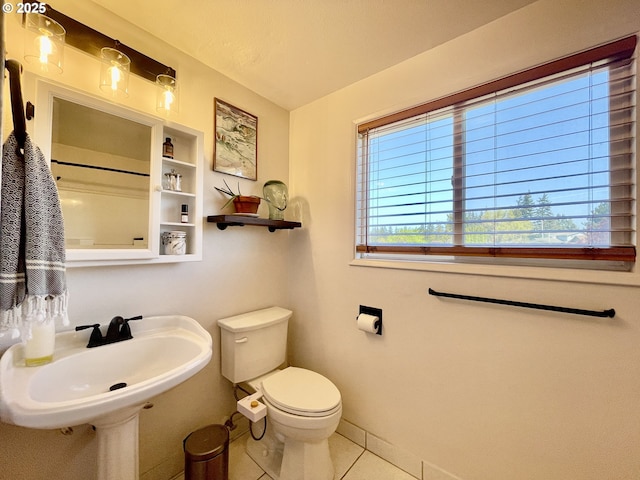 3851 Edgewood Dr, North Bend, OR 97459 - bathroom with toilet, tile patterned floors, baseboards, a sink, and built in features