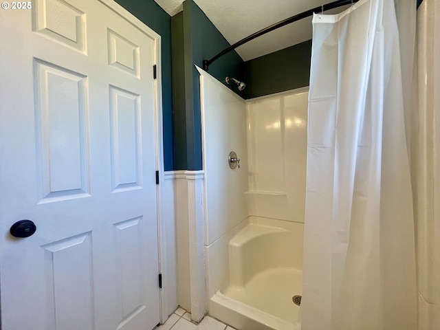 3851 Edgewood Dr, North Bend, OR 97459 - bathroom with curtained shower and tile patterned floors